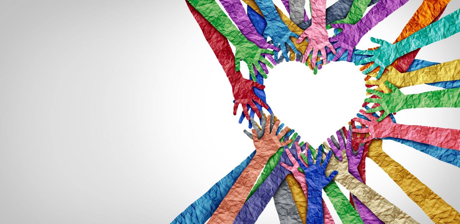 Colorful hands coming together to form a heart, representing community and connection